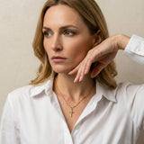 Gold Cross Necklace with Wavy Links