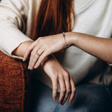 Gold Cross & Elegant Pearls Bracelet