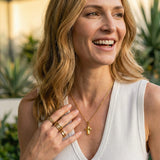 Gold Cross Necklace with Rounded Shapes